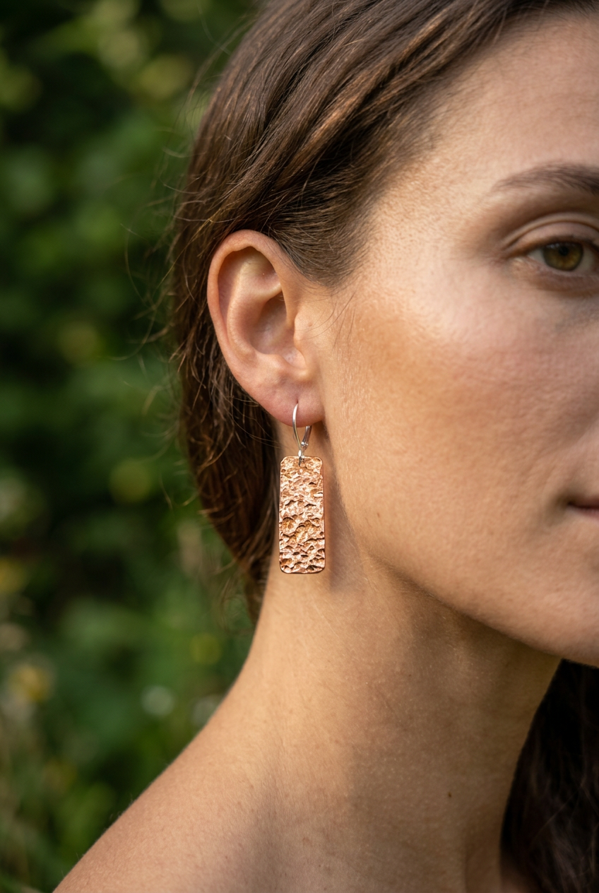 Model wearing the hammered copper bar earring with silver leverback fitting